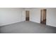 Spacious bedroom with grey carpet and an ensuite bathroom at 5114 Villa Crest Way, Auburndale, FL 33823
