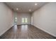Living area with tile flooring and access to the backyard at 5114 Villa Crest Way, Auburndale, FL 33823