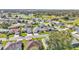 Community view showcasing homes near a golf course and lake at 5873 Macaw Pl, Lakeland, FL 33809