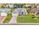 Aerial view showing a single-Gathering home's landscaping and driveway at 5873 Macaw Pl, Lakeland, FL 33809