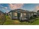 Home's backyard features a pergola-covered patio at 5873 Macaw Pl, Lakeland, FL 33809