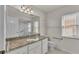 Bathroom with granite countertop and window at 5873 Macaw Pl, Lakeland, FL 33809