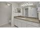 Main bathroom with granite vanity and shower at 5873 Macaw Pl, Lakeland, FL 33809