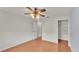 Bright bedroom with wood floors and ceiling fan at 5873 Macaw Pl, Lakeland, FL 33809