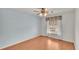 Simple bedroom with wood floor and ceiling fan at 5873 Macaw Pl, Lakeland, FL 33809