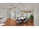 Dining room staged with modern furniture and light fixtures at 5873 Macaw Pl, Lakeland, FL 33809