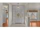 Bright entryway with white door and wood floors at 5873 Macaw Pl, Lakeland, FL 33809