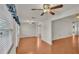 Bright Gathering room with hardwood floors and multiple ceiling fans at 5873 Macaw Pl, Lakeland, FL 33809