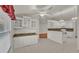 Kitchen boasts granite counters, white cabinets, and ample counter space at 5873 Macaw Pl, Lakeland, FL 33809