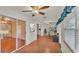 Bright sunroom features wood floors, sliding glass doors and a built-in workspace at 5873 Macaw Pl, Lakeland, FL 33809