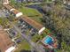Aerial view of condo community with pool and parking at 6123 Topher Trl # 63C, Mulberry, FL 33860