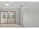 Bright living room with sliding glass doors at 6123 Topher Trl # 63C, Mulberry, FL 33860