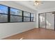 Sunroom with wood floors and sliding doors at 6123 Topher Trl # 63C, Mulberry, FL 33860