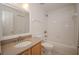 Clean bathroom with a single sink vanity and bathtub at 7018 Cascades Ct, Lakeland, FL 33813