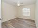 Bright bedroom with wood-look floors and a large window at 7018 Cascades Ct, Lakeland, FL 33813