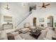 Bright living room with vaulted ceiling, neutral colors, and comfy furniture at 7018 Cascades Ct, Lakeland, FL 33813
