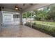 Screened porch with tile flooring, ceiling fan and access to backyard at 7018 Cascades Ct, Lakeland, FL 33813