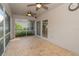 Spacious screened porch with tile floor and ceiling fans at 7018 Cascades Ct, Lakeland, FL 33813