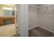 Bright walk-in closet with wire shelving and wood-look floors at 7018 Cascades Ct, Lakeland, FL 33813