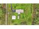 Aerial view of house and detached garage at 9240 Moore Rd, Lakeland, FL 33809