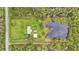 Aerial view of property with house and pond at 9240 Moore Rd, Lakeland, FL 33809