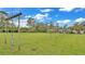 Spacious backyard with a pond and lush greenery at 9240 Moore Rd, Lakeland, FL 33809
