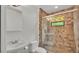 Updated bathroom with a walk-in shower and tile flooring at 9240 Moore Rd, Lakeland, FL 33809