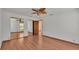 Well-lit bedroom with mirrored closet doors and wood flooring at 9240 Moore Rd, Lakeland, FL 33809