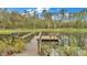 Picturesque dock on a tranquil pond at 9240 Moore Rd, Lakeland, FL 33809