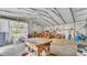 Spacious garage featuring a workbench and tractor at 9240 Moore Rd, Lakeland, FL 33809