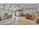 Large metal garage with a tractor and various tools at 9240 Moore Rd, Lakeland, FL 33809