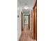 Bright hallway with wood-look flooring and multiple doors at 9240 Moore Rd, Lakeland, FL 33809