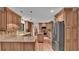 Modern kitchen with wood cabinets, granite countertops, and stainless steel appliances at 9240 Moore Rd, Lakeland, FL 33809