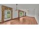 Bright living room featuring hardwood floors and large windows with natural light at 9240 Moore Rd, Lakeland, FL 33809