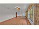 Bright living room with wood floors and a ceiling fan at 9240 Moore Rd, Lakeland, FL 33809