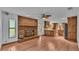 Open living room showcasing a fireplace and kitchen views at 9240 Moore Rd, Lakeland, FL 33809