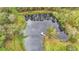 Overlooking a serene pond with a dock at 9240 Moore Rd, Lakeland, FL 33809