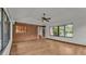 Sunroom with brick wall, wood floors, and access to the backyard at 9240 Moore Rd, Lakeland, FL 33809