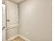 Laundry room with tile flooring and built-in shelving at 1230 Tagliamento Ln, Haines City, FL 33844