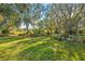 Expansive backyard with lush landscaping at 150 Woodcrest Ln, Mulberry, FL 33860