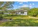 Spacious backyard with lush landscaping at 150 Woodcrest Ln, Mulberry, FL 33860