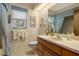 Clean bathroom with light wood cabinets and blue accents at 150 Woodcrest Ln, Mulberry, FL 33860