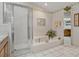 Bathroom with soaking tub, shower, and double vanity at 150 Woodcrest Ln, Mulberry, FL 33860