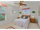 Comfortable bedroom with wood furniture and a view of the backyard at 150 Woodcrest Ln, Mulberry, FL 33860