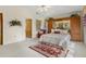Main bedroom with a king-size bed and built-in cabinetry at 150 Woodcrest Ln, Mulberry, FL 33860