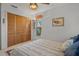 Bright bedroom with a double bed and built-in wooden wardrobe at 150 Woodcrest Ln, Mulberry, FL 33860
