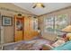Cozy den with a large wooden cabinet and comfortable seating at 150 Woodcrest Ln, Mulberry, FL 33860