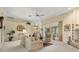 Open living room with large windows and view to the backyard at 150 Woodcrest Ln, Mulberry, FL 33860