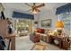 Cozy living room featuring a sofa and access to a patio at 150 Woodcrest Ln, Mulberry, FL 33860