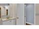 Clean bathroom with single sink and access to other rooms at 1555 Archers Path, Lakeland, FL 33809